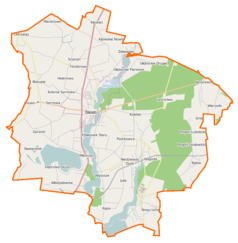Mapa konturowa gminy Ślesin, blisko centrum na lewo znajduje się punkt z opisem „Ślesin”