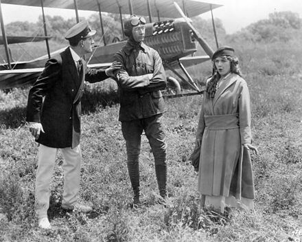 Kenneth Douglas, Glenn Martin and Mary Pickford in the silent comedy A Girl of Yesterday (1915). A Martin Model TT biplane is behind them.