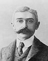 Pierre de Coubertin (Charles Pierre de Frédy, barone di Coubertin) (Parigi, 1u di ginnaggiu 1863 - Ginevra, 2 di cabbidannu 1937)