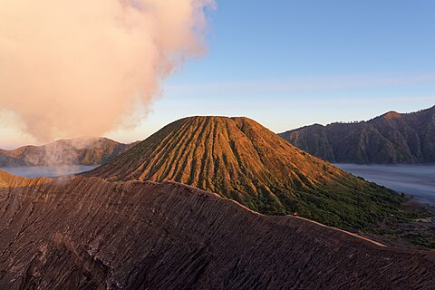 Mount Batok in the light of rising sun, view from the volcanic cone of Mount Bromo