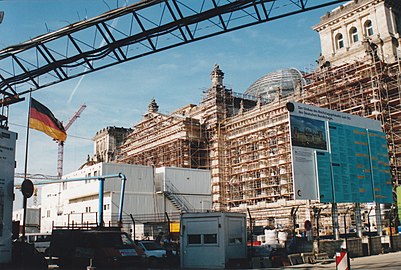 The Reichstag covered in scaffolding during its reconstruction, August 1998. The new dome can be seen above the roofline.