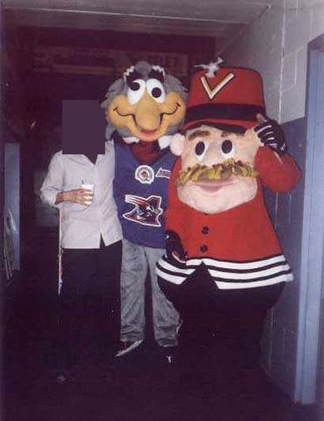 Blitz (centre), late mascot of the Montreal Alouettes, poses for a photo with late ice hockey mascot Boum-Boum (right) of the Drummondville Voltigeurs