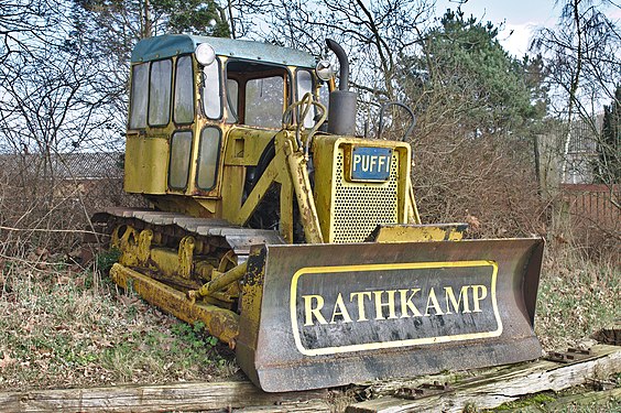 Bulldozer wreck by a farm entrance in Kirchhatten, Germany.