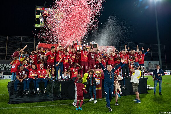 CFR Cluj celebrating their fifth consecutive Liga I title at the end of the 2021–22 season.