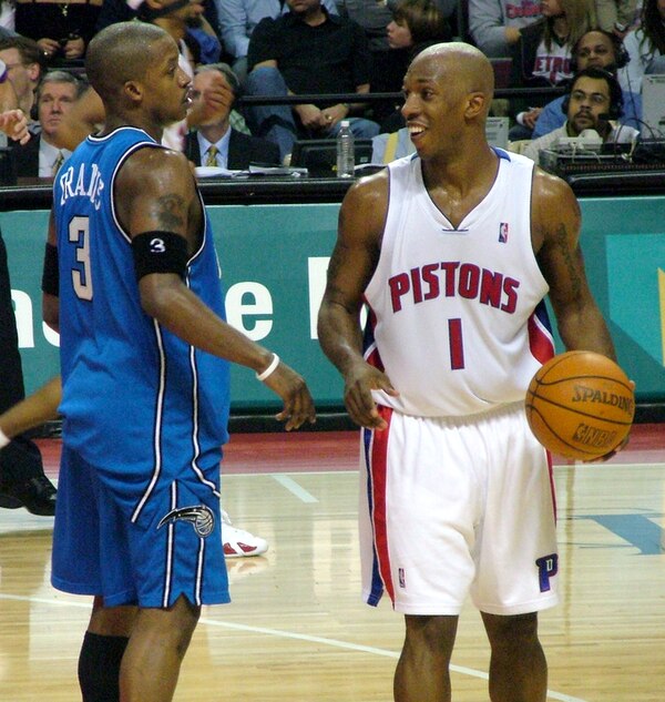 Francis (left) talking with Chauncey Billups.