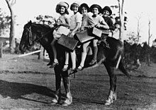 Children riding a horse to school, Glass House Mountains Children riding a horse to school, Glass House Mountains (3219069891).jpg