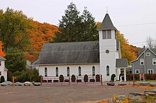 Church in Noxen, Pennsylvania, surrounded by fall foliage