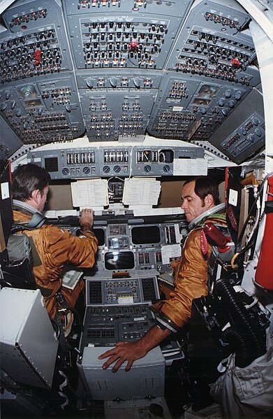 STS-1 crew in Space Shuttle Columbia's cabin. This is a view of training in 1980 in the Orbiter Processing Facility.