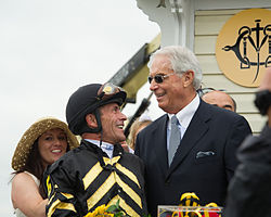 Oxbow was trained by D. Wayne Lukas (right) and was ridden by Gary Stevens during his Triple Crown campaign. Stevens is pictured wearing the colors of Oxbow's owner Brad M. Kelley. D Wayne Lukas and Gary Stevens.jpg