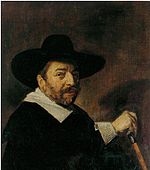 Frans Hals - Siyah giyimli, beyaz yakalı ve kelepçeli ve üstünde gümüş renkli baston tutan bir adamın portresi - 1643.jpg