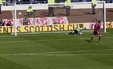 Pressley scores past Gretna goalkeeper Alan Main in the 2006 Scottish Cup Final penalty shootout. Hearts vs. Gretna Scottish Cup final.jpg