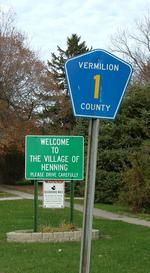 Signs at the south edge of town Henning Illinois sign.png