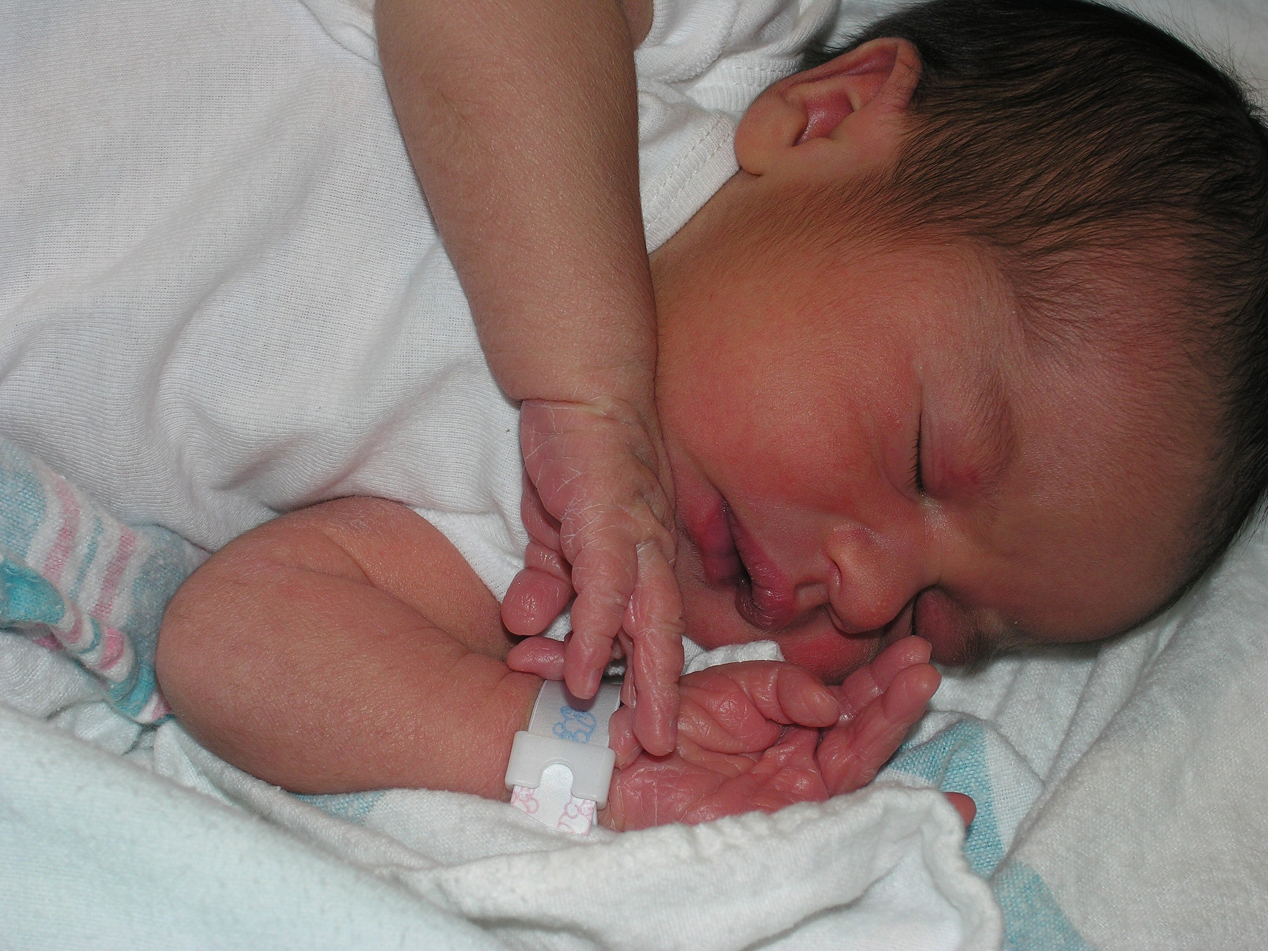 cute newborn baby girl in hospital