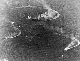 Japanese aircraft carrier Zuikaku and two destroyers under attack on 20 June 1944 (80-G-238025).jpg