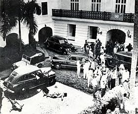 The bodies of Nationalists Carlos Hiraldo Resto and Manuel Torres Medina lie on the ground in San Juan La Fortaleza attack-1950.jpg