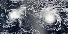 A weakening Hurricane Madeline near Hawaii on August 31, with the much stronger Hurricane Lester to its east Lester and Madeline 2016-08-31 2250Z.jpg