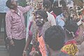 Man holding Python at Yanamalakuduru Shivaratri celebrations 02