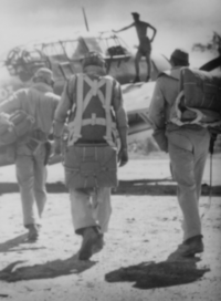 A US Marine TBF Avenger crew prepares for another mission over Rabaul Marine TBF Crew, 1944.PNG