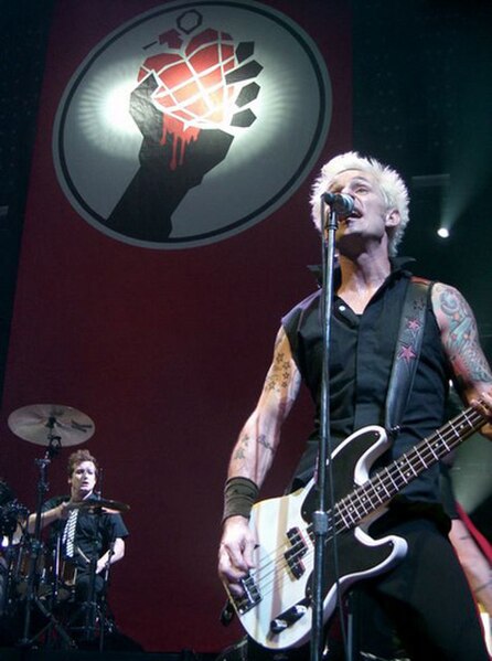 Tré Cool (bottom left) and Mike Dirnt (right) performing on July 27, 2005