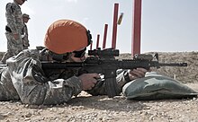 A member of the 1st Squadron, 112th Cavalry Regiment firing a carbine during a competition held as part of a deployment to the Sinai region of Egypt in 2015 Nevada Guardsman takes home top honors during Task Force Sinai quarterly competition 150319-A-BE343-006.jpg