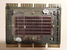 One of three inter-connected modules that make up an Omnibus-based PDP-8 core memory plane. This is the middle of the three and contains the array of actual ferrite cores. PDP-8 core memory.jpg