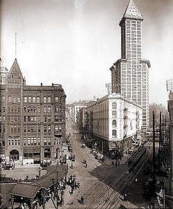 Pioneer Square, March 17, 1917. In the upper-right is the Smith Tower. Below it is the Seattle Hotel. On the left are the Pioneer Building and the pergola. Pioneer square.jpg