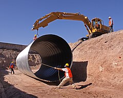 Dangerous tasks are common in the construction workplace. Pipe installation 2.jpg