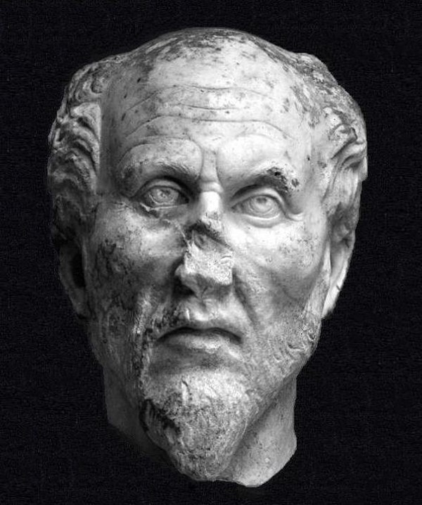 Head in white marble. The identification as Plotinus is plausible but not proven.