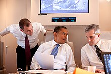 McDonough conferring with Obama about the Cairo Speech, with Ben Rhodes, on June 4, 2009. President Barack Obama confers about the Cairo speech with Denis McDonough and speechwriter Ben Rhodes on Air Force One en route to Cairo, Egypt, June 4, 2009.jpg