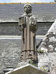 Église paroissiale Saint-Ouen de Quéménéven : porche sud, statue de saint Laurent.