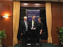 Rob Ellison (centre) winner of the national Sidney Wicks Competition at the presentation of the award, with David Matters President of Rostrum Australia and Councillor Kate Richards, Pullenvale Ward, Brisbane City Council Rob Ellison (centre) winner of the national Sidney Wicks Competition at the presentationof the ward, with David Matters President of Rostrum Australia and Councillor Kate Richards, Pullenvale Ward, Brisbane City Council.jpg