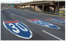 Route shield pavement markings for Interstate Highways 30 and 35E at the Dallas Horseshoe. Route shield pavement markings for Interstate Highways 30 and 35E in Dallas.png