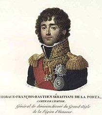 Painting shows a curly-haired man wearing a blue military uniform with gold epaulettes, gold lace and a red sash.