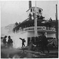 Steamer "Victorian" in port. People on deck and on the dock.