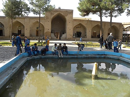 Students in Shah Abbasi caravansary of Nishapur 04.JPG