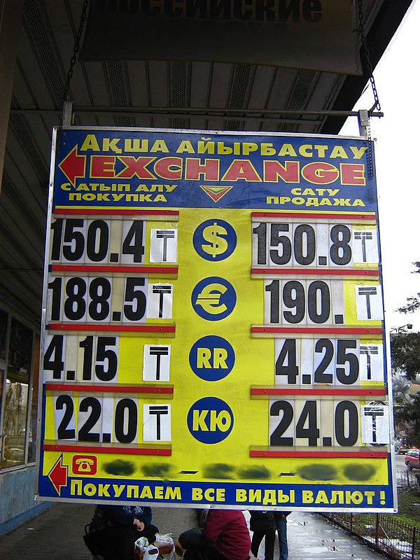 New symbol of tenge (₸) used on info-board of a currency exchange office in Almaty