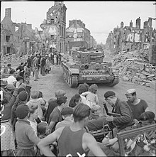 Cromwell tanks of 2nd Northamptonshire Yeomanry, 11th Armoured Division, passing through Flers, 17 August 1944 The British Army in the Normandy Campaign 1944 B9329.jpg
