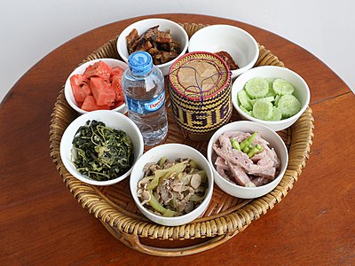 Tray with bowls of food cooked for the Buddhist monks of the temple of Don Det, Laos