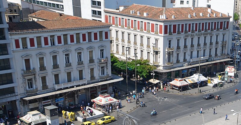 File:Two of the most recognizable buildings in Omonoia Square. The Bagkeion Mansion (Μπάγκειον) building on the left and the Megas Alexandros (Μέγας Αλέξανδρος) building on the right..JPG