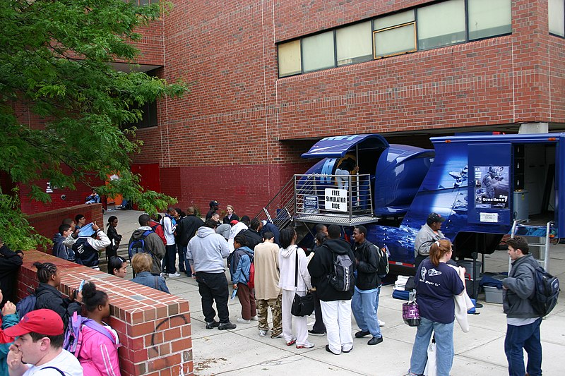 File:US Navy 050615-N-6525H-083 Charlestown High School students wait in line for their turn to try the U.S. Navy Blue Angels F-A-18 Hornet simulator during Boston Navy Week, a week of Navy events and activities throughout the area.jpg