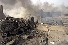 The bombing of Al Sabaah, 2006 US Navy 060827-N-6477M-617 A Vehicle Born Improvised Explosive Devise (VBIED) after exploding on a street outside of the Al Sabah newspaper office in the Waziryia district of Baghdad, Iraq.jpg
