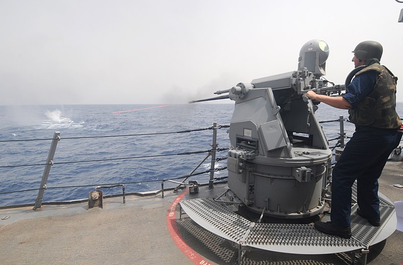 File:US Navy 110722-N-XQ375-242 Gunner's Mate 3rd Class Travis Hoffman fires a MK 38 25mm machine gun during a gun exercise aboard the guided-missile de.jpg