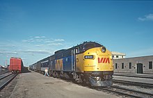 A Via GMD FP7 leads the Canadian in Regina, May 1982. The Canadian was rerouted in the 1990s, ending service to several cities, like Calgary. VIA 6501 with Train 109 at Regina, SK in May 1982 (32098880841).jpg