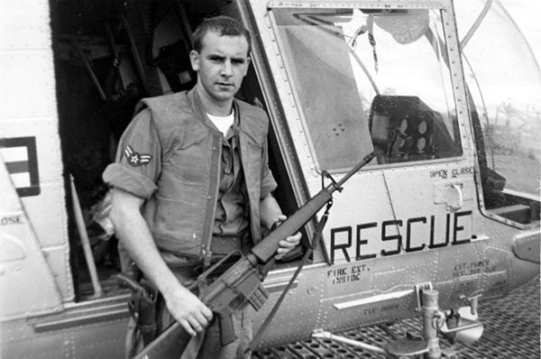 A1C William Pitsenbarger with an M16 outside the HH-43.