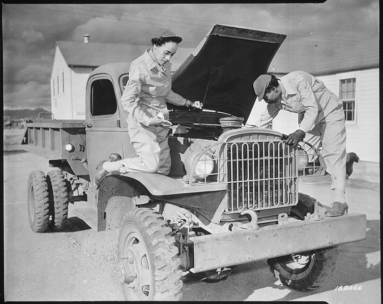 File:"Auxiliaries Ruth Wade and Lucille Mayo (left to right) further demonstrate their ability to service trucks as taught th - NARA - 531153.jpg