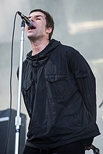 Frontman Liam Gallagher wrote a number of songs for Oasis starting in 2000, including singles "Songbird" and "I'm Outta Time". 2017 RiP - Liam Gallagher - by 2eight - 8SC1562.jpg