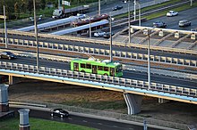 Trolleybus passing by the overpass on Richard Sorge Street