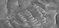 Close view of short triangular shapes, as seen by HiRISE under HiWish program These may be some sort of dune feature combined with a ridge.