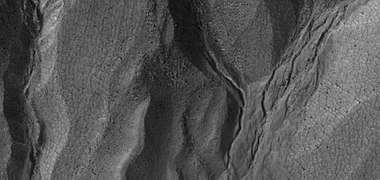Close view of gullies, as seen by HiRISE under HiWish program. Polygonal shapes are visible.