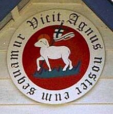The emblem of the Moravian Church depicts an image of the Lamb of God (Agnus Dei in ecclesiastical Latin) with the flag of victory, surrounded by the Latin inscription: Vicit agnus noster, eum sequamur (English: "Our Lamb has conquered, let us follow Him"). Agnus noster.jpg